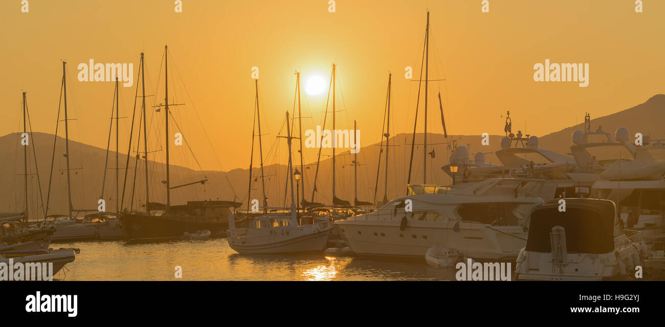 Sail boats against the sunset at Paros island in Greece Stock Photo Alamy
