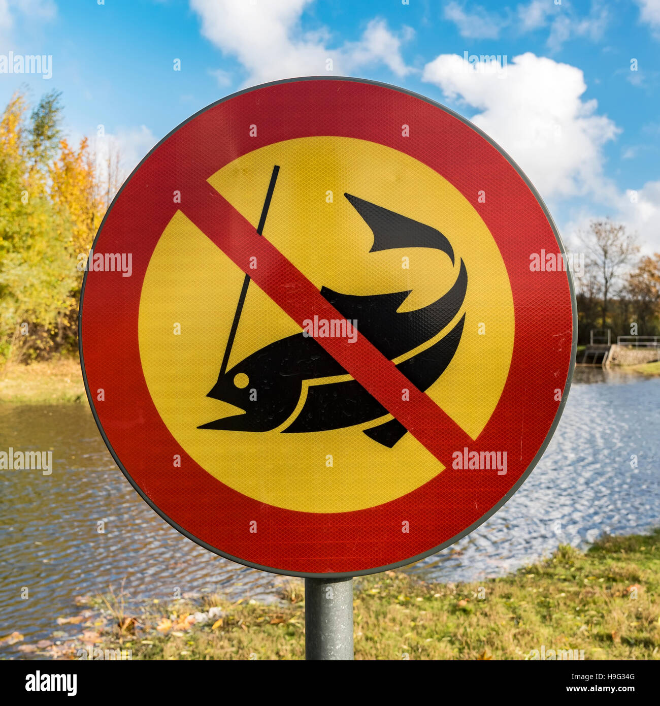 No fishing sign next to a park lake or pond. Stock Photo