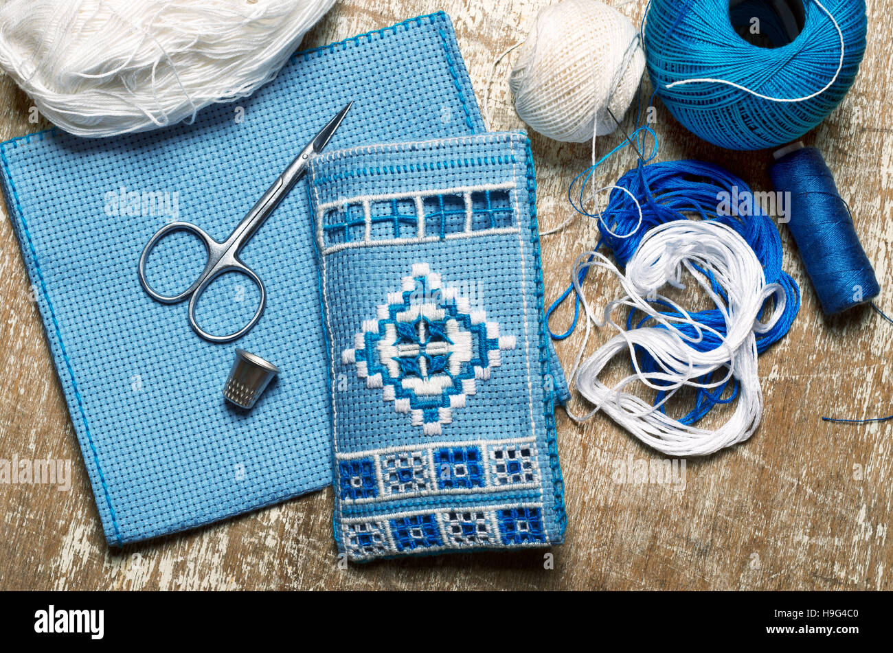 Hardanger embroidery blue and white colors with instruments Stock Photo
