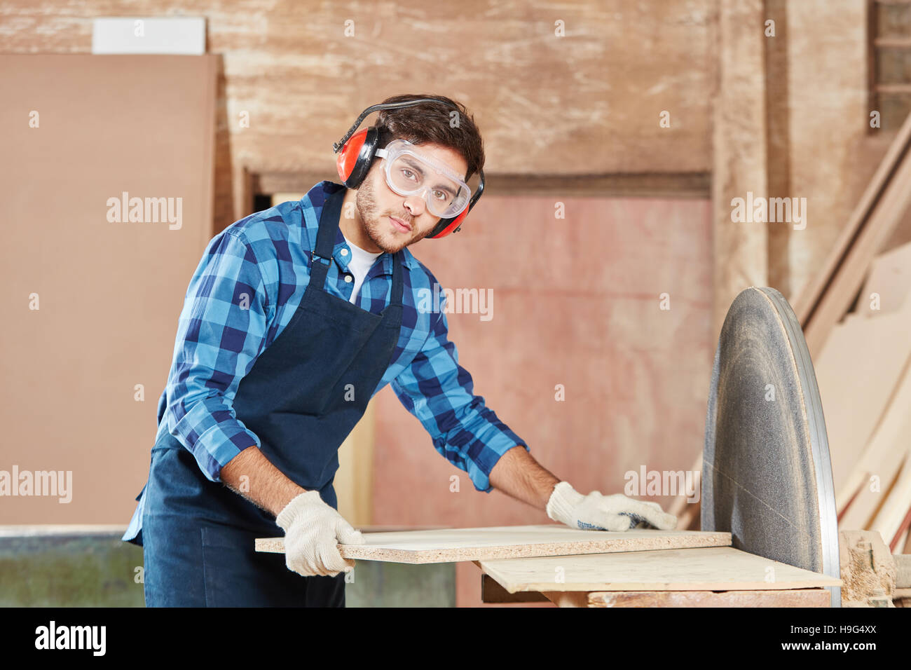 Man working with grind machine at workshop Stock Photo