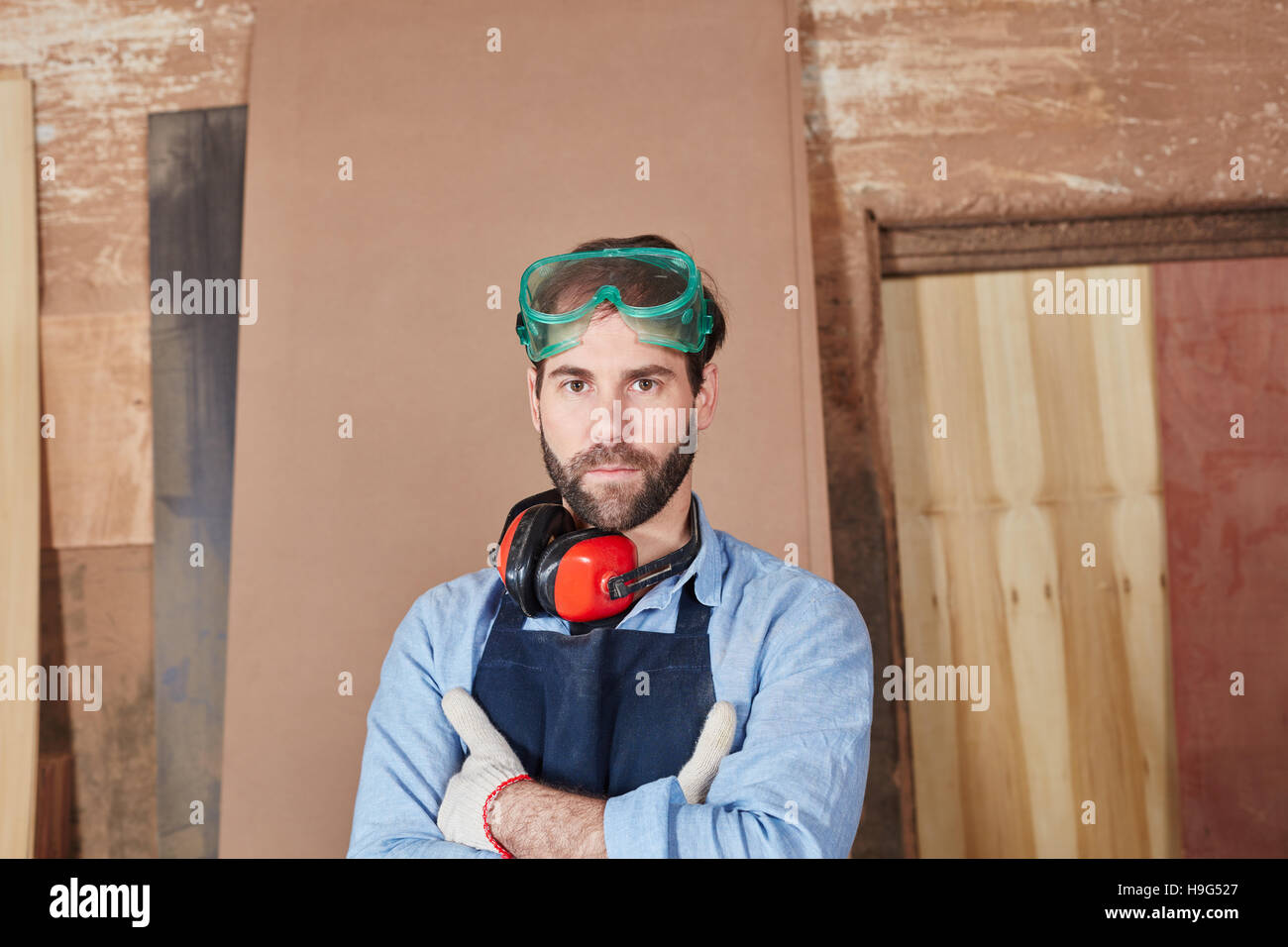 Man as artisan with arms crossed looking confident Stock Photo Alamy