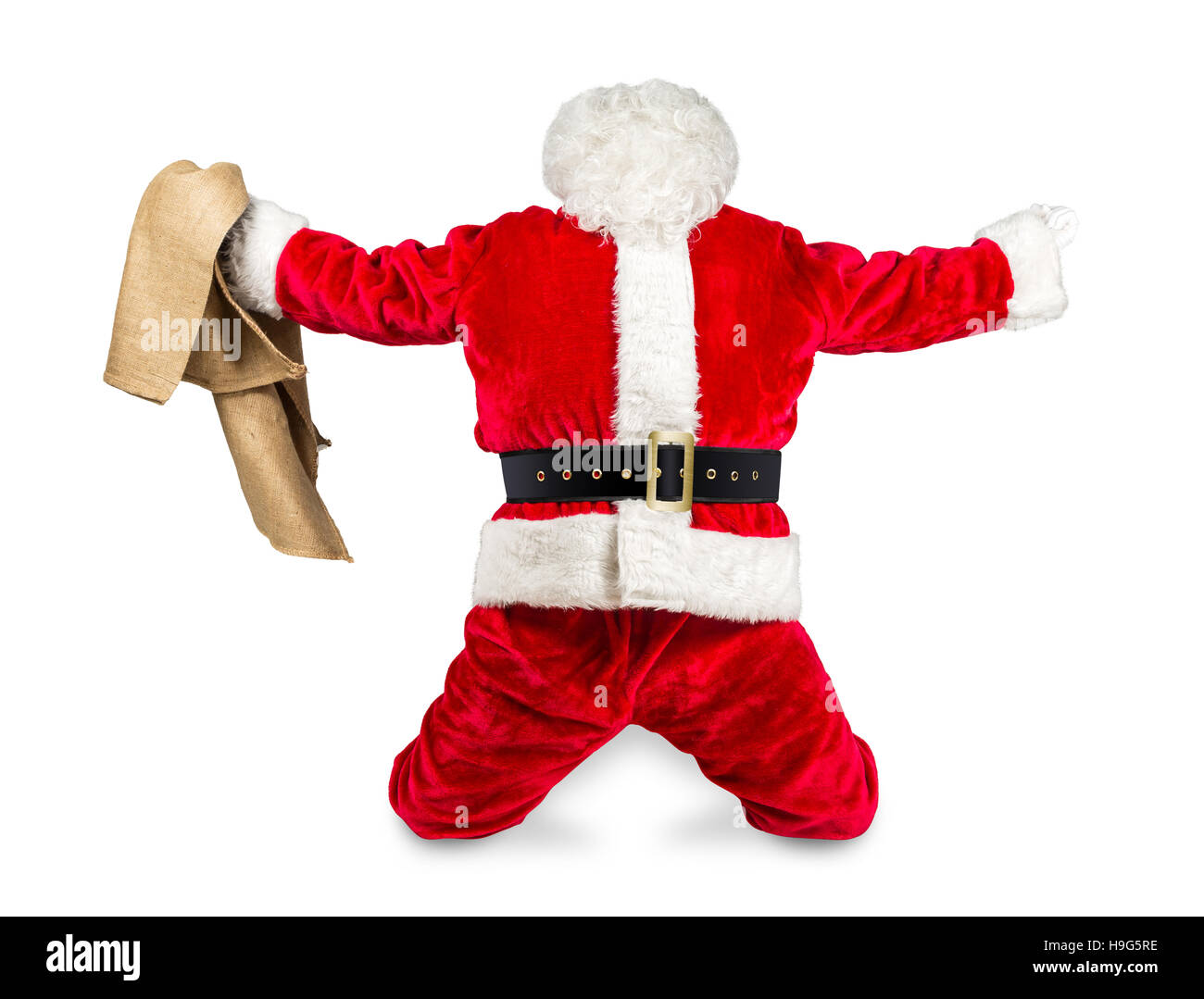 funny crazy hilarious red white santa claus celebration clench fist holding bag in the air job done isolated on white background Stock Photo