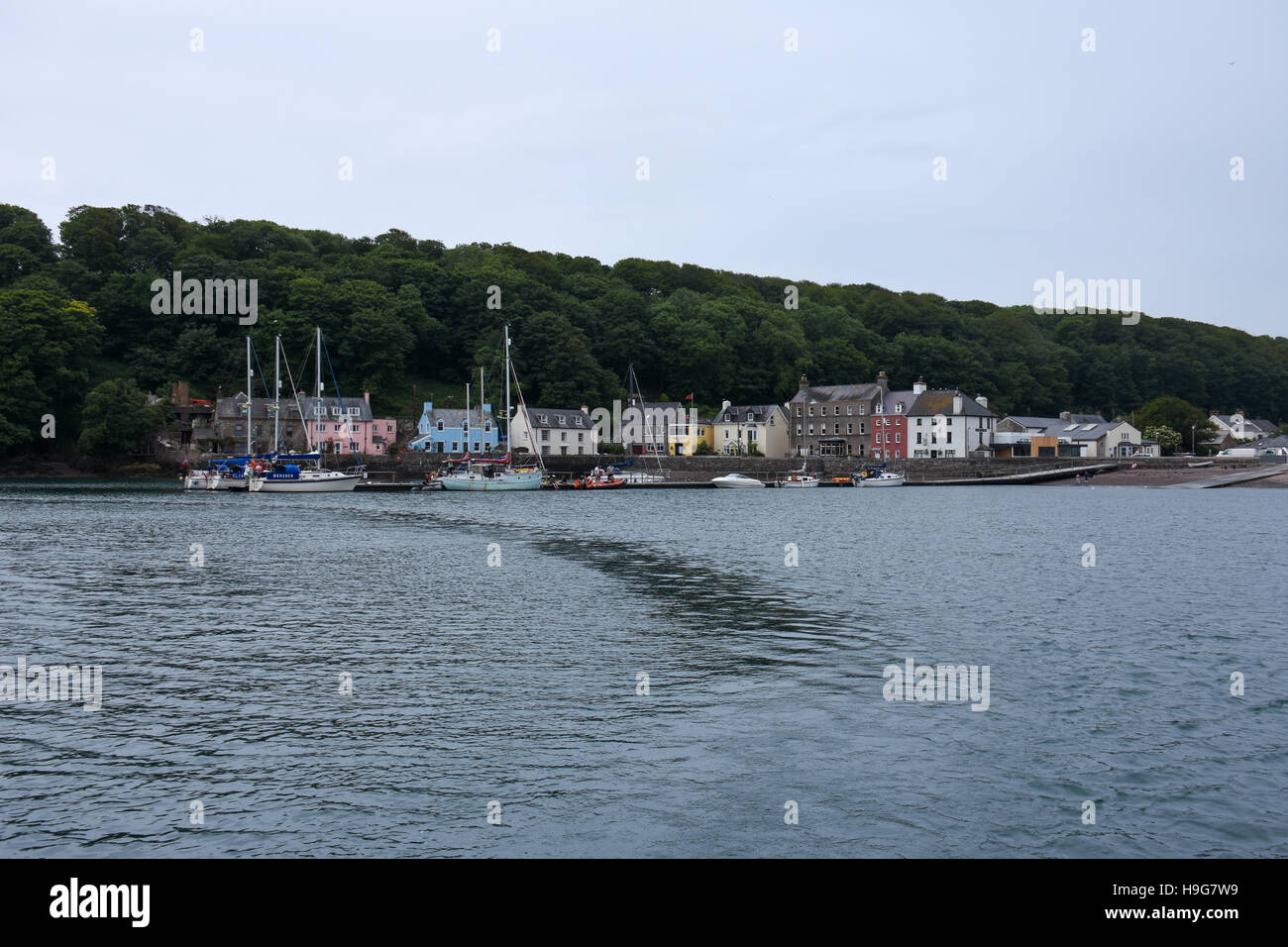 Yachts moored to the pontoon at Dale while the tide is in. Stock Photo