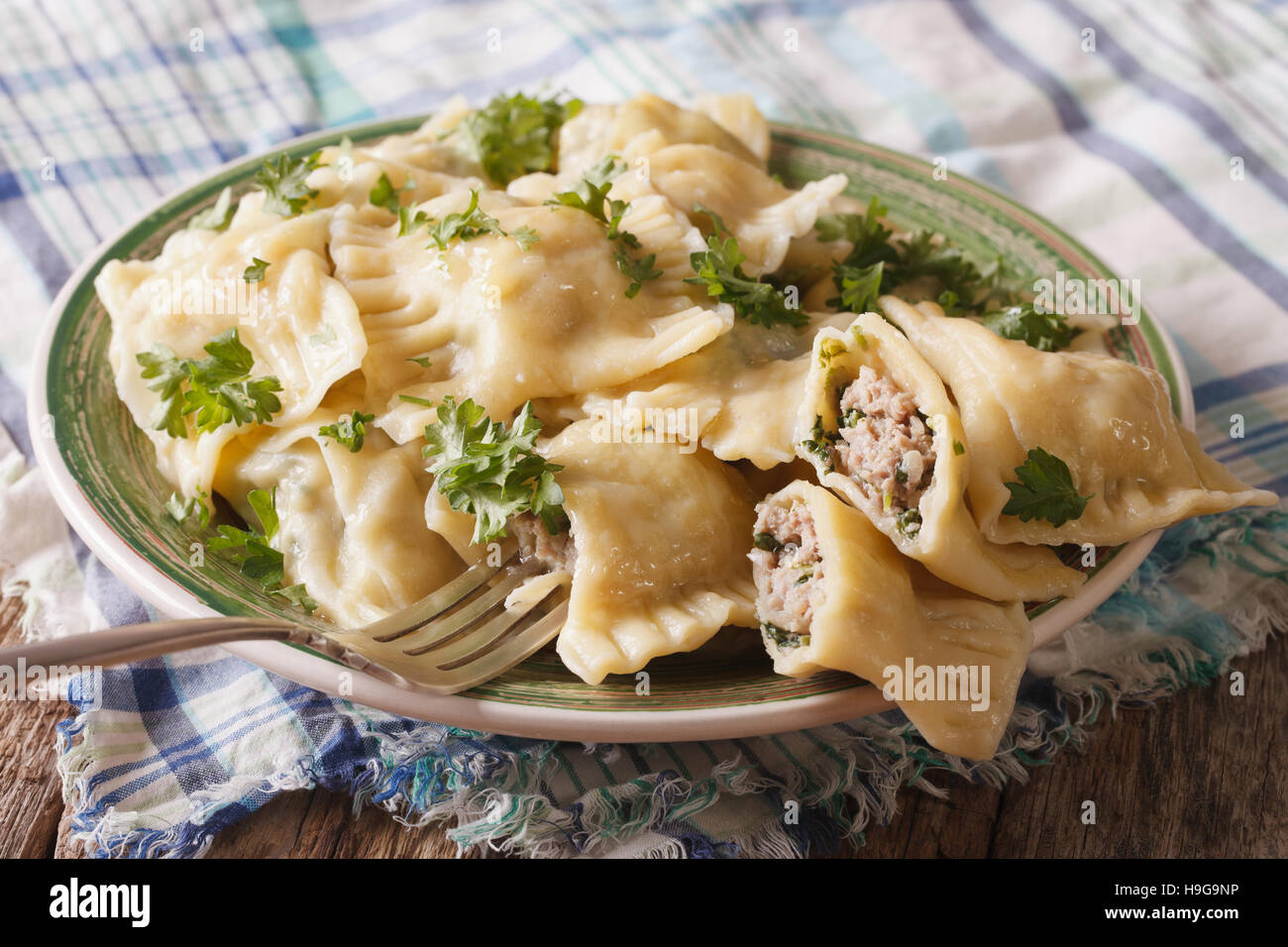 German ravioli Maultaschen with spinach and meat close up on a plate. horizontal Stock Photo