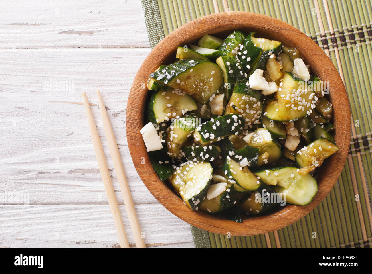 Chinese cucumber salad with sesame seeds close up in a bowl. horizontal view from above Stock Photo