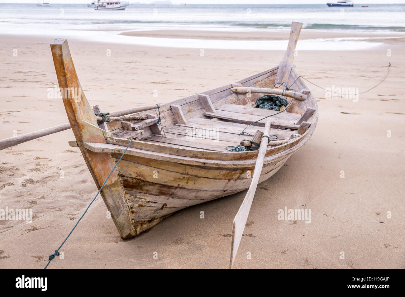 Wooden longtail boat on beach in Ko Lanta, Thailand Stock Photo