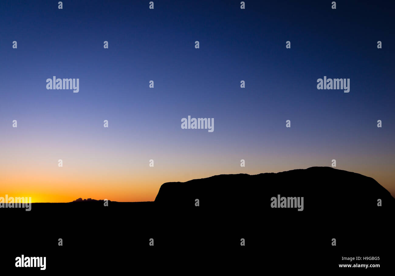 Sunset silhouette of Uluru and Kata Tjuta Stock Photo