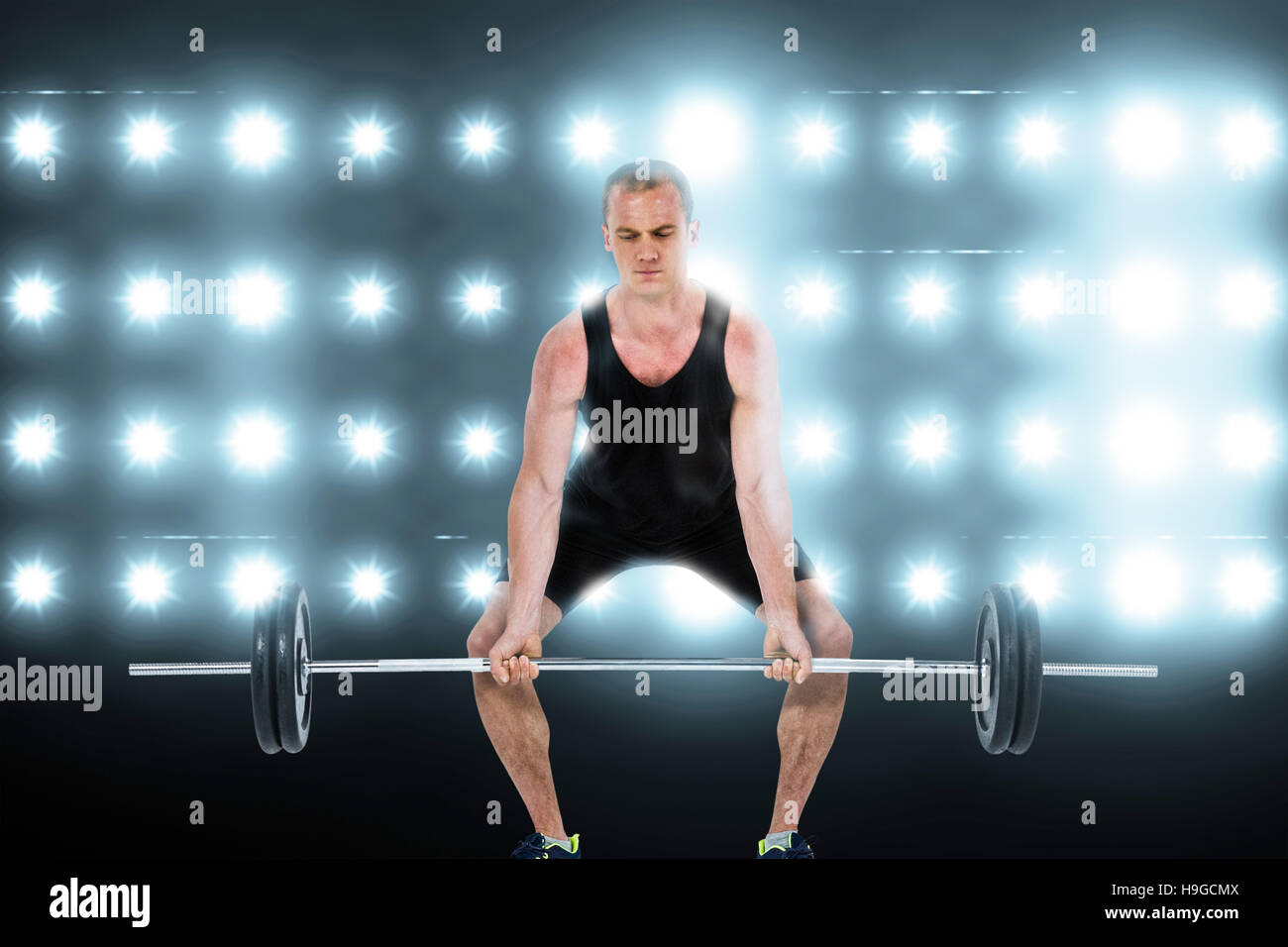 Composite image of bodybuilder lifting heavy barbell weights Stock Photo