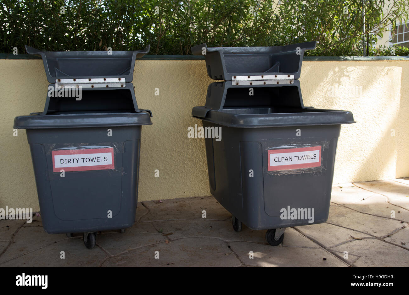 Poolside bins for clean and dirty towels. Plastic bins at a swimming pool Stock Photo Alamy