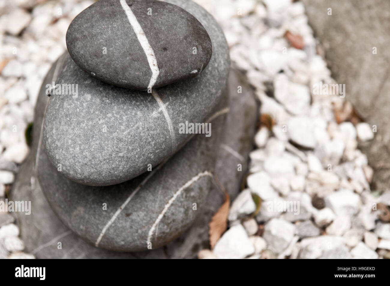 pebbles stacked up outdoors, natural stone Stock Photo