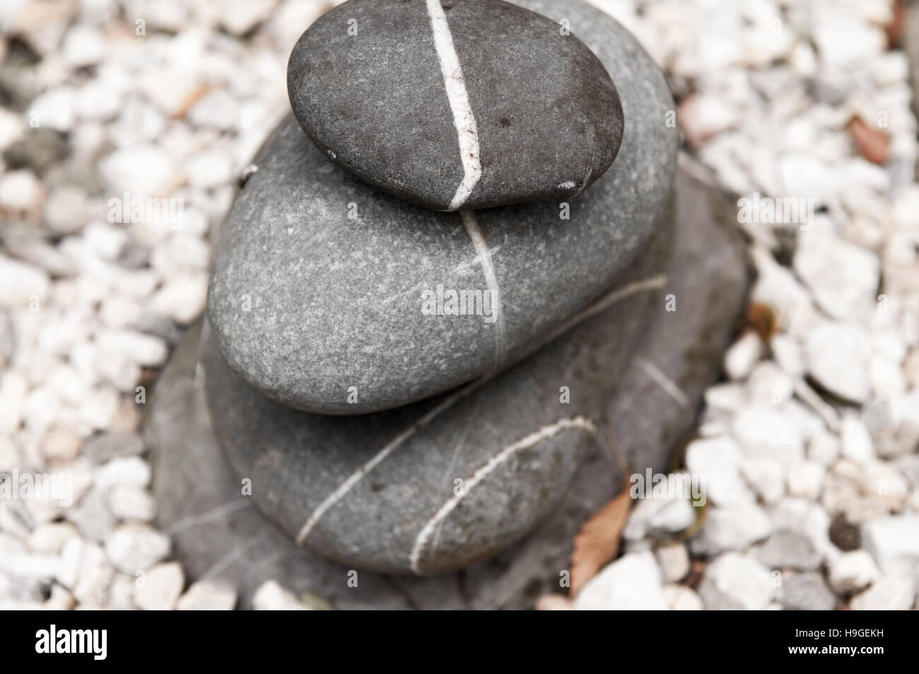 pebbles stacked up outdoors, natural stone Stock Photo