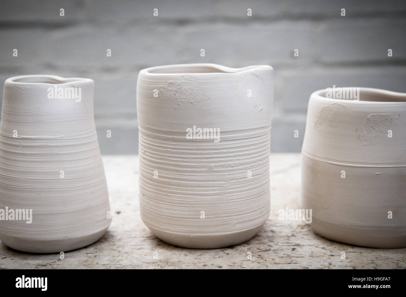 Hand made ceramic pots in the studio in natural daylight Stock Photo