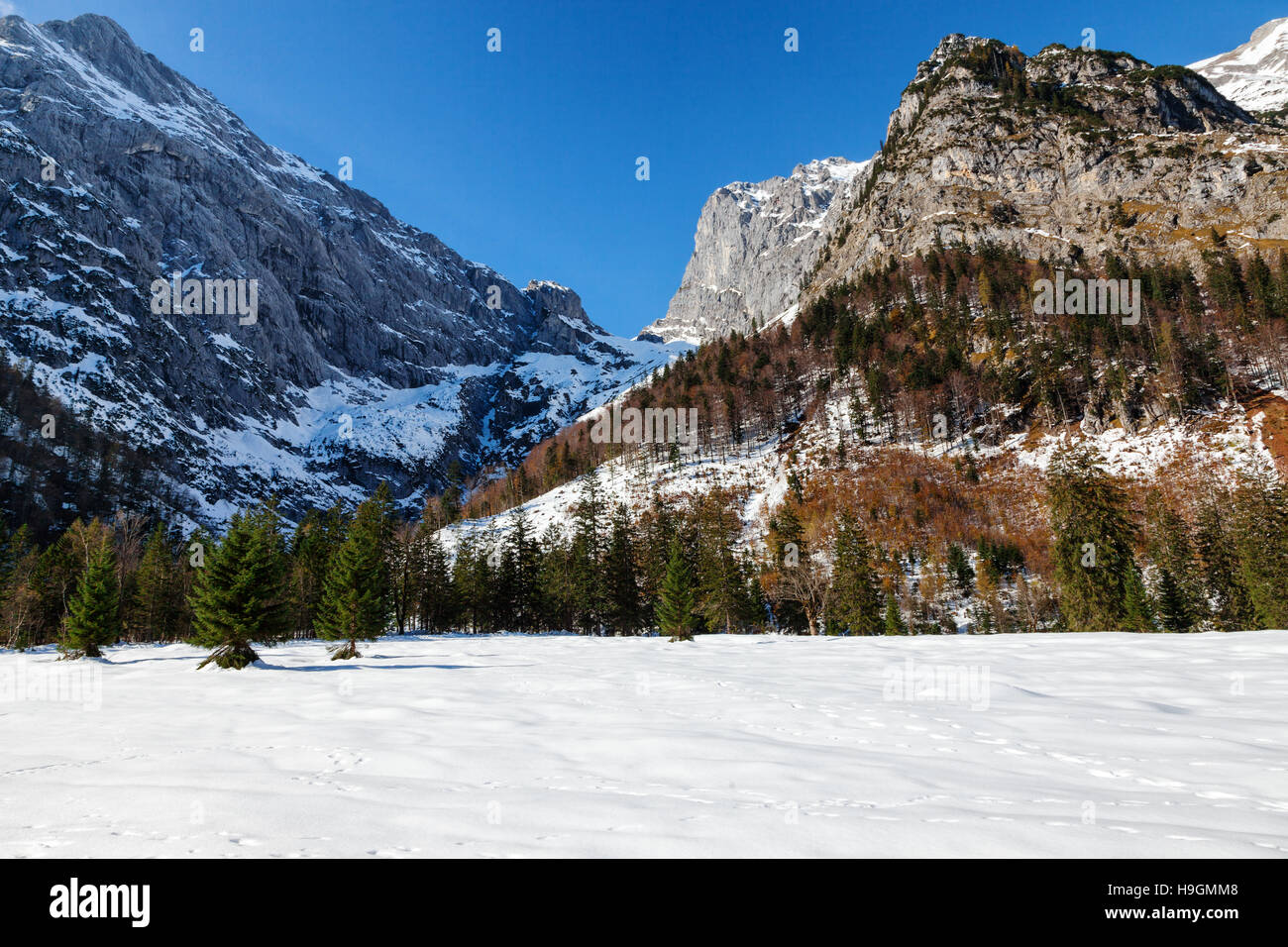 Alps landscape with snow capped mountains in the late autumn season. Stock Photo