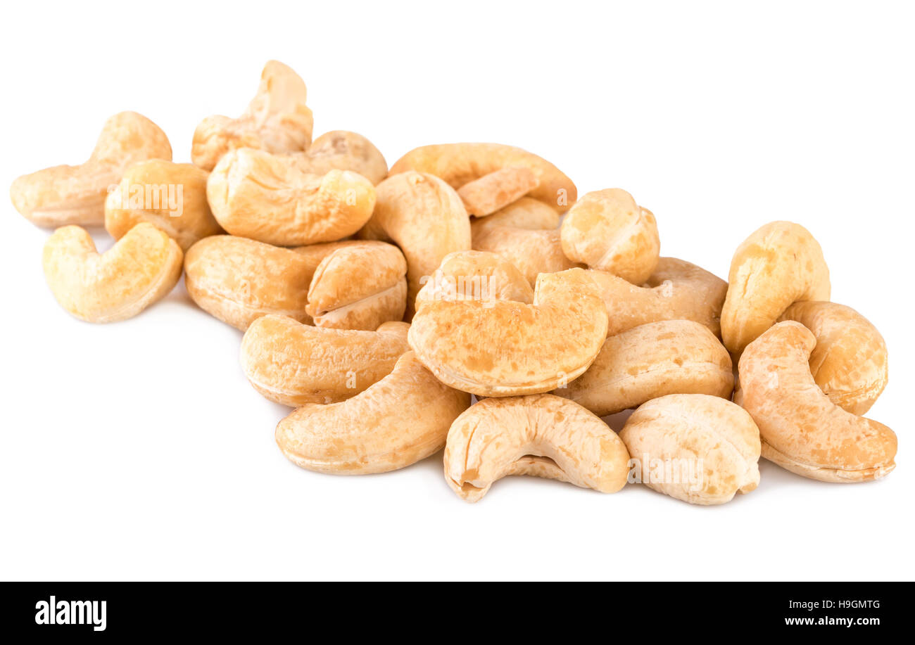 Cashew nuts heap handful on white Stock Photo