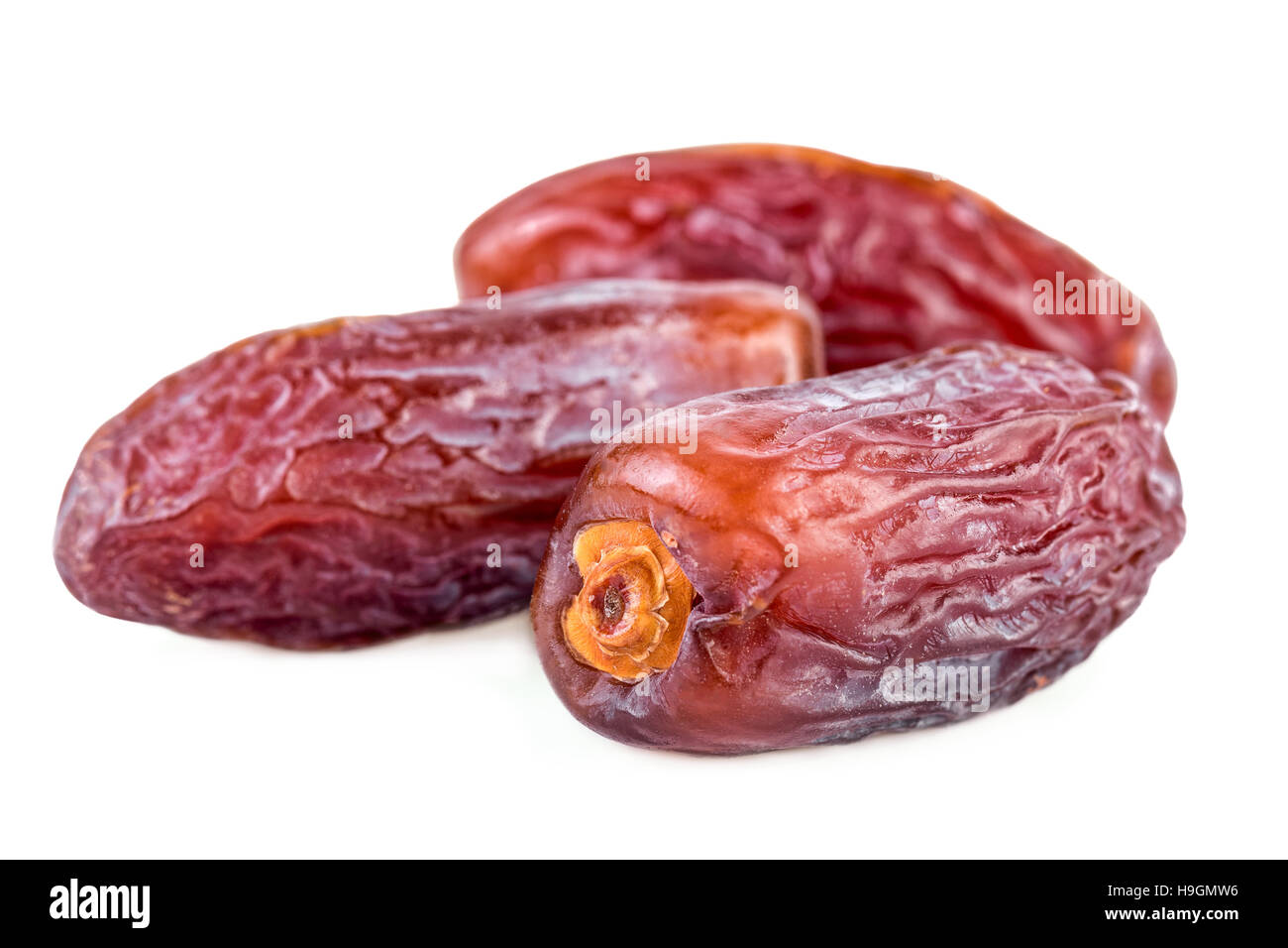 Dried dates fruits on white Stock Photo