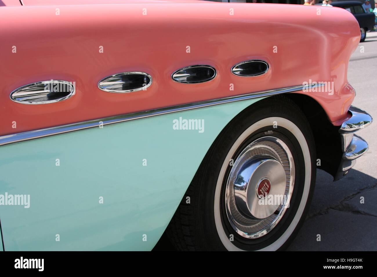 Automotive detail of a fender on a 1956 coral pink and aqua green Buick Century Hardtop Stock Photo