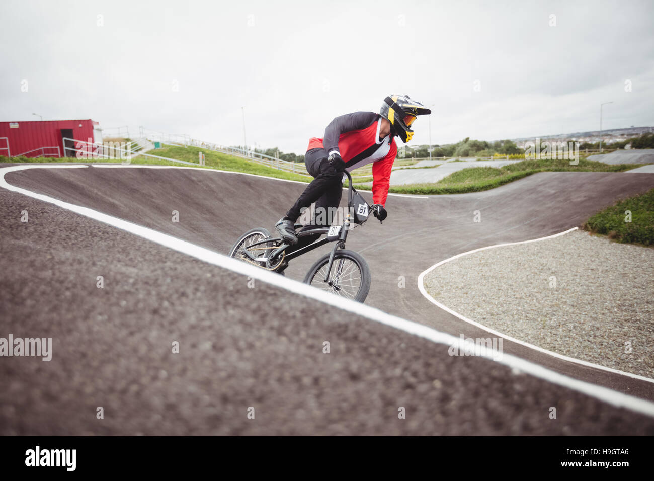 Cyclist riding BMX bike Stock Photo - Alamy
