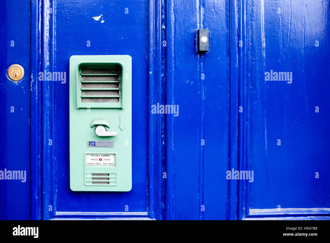 Call bell intercom on a blue door, common on rural Gardai (Irish Police) stations Stock Photo