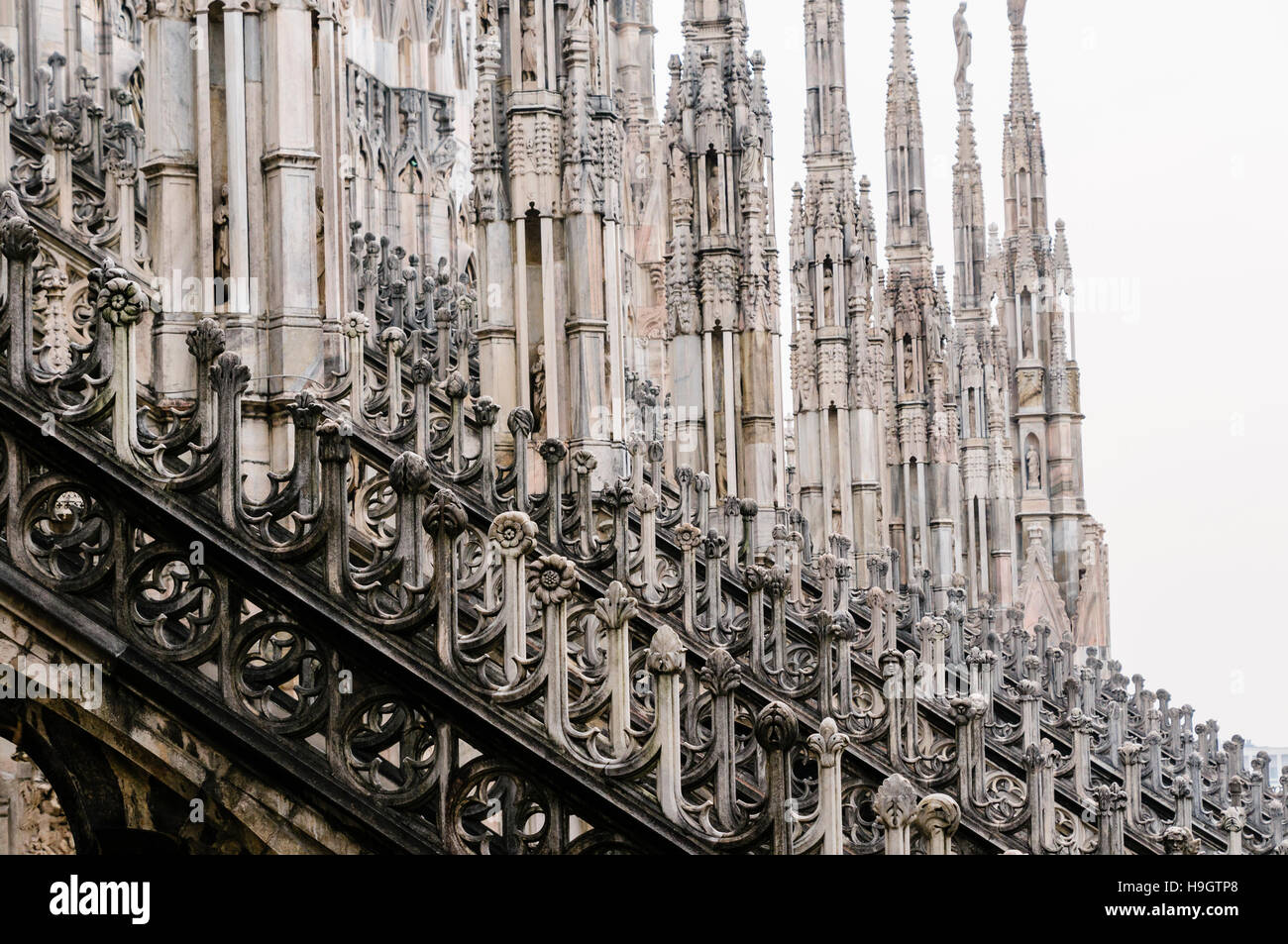 Flying buttress and ornately carved stonework on the roof of the Duomo di Milano (Milan Cathedral), Italy Stock Photo