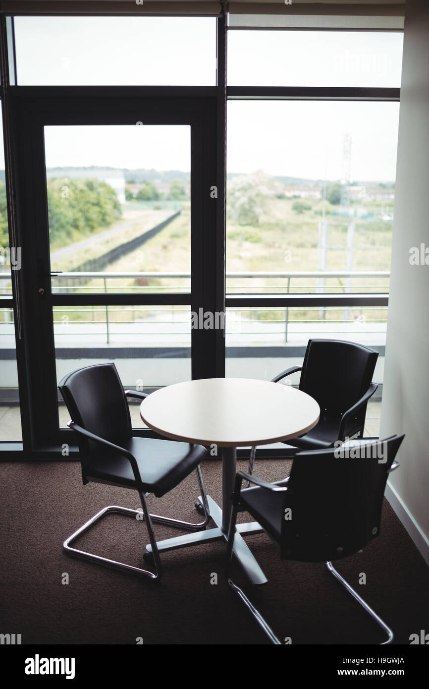 Round table and chairs in office Stock Photo
