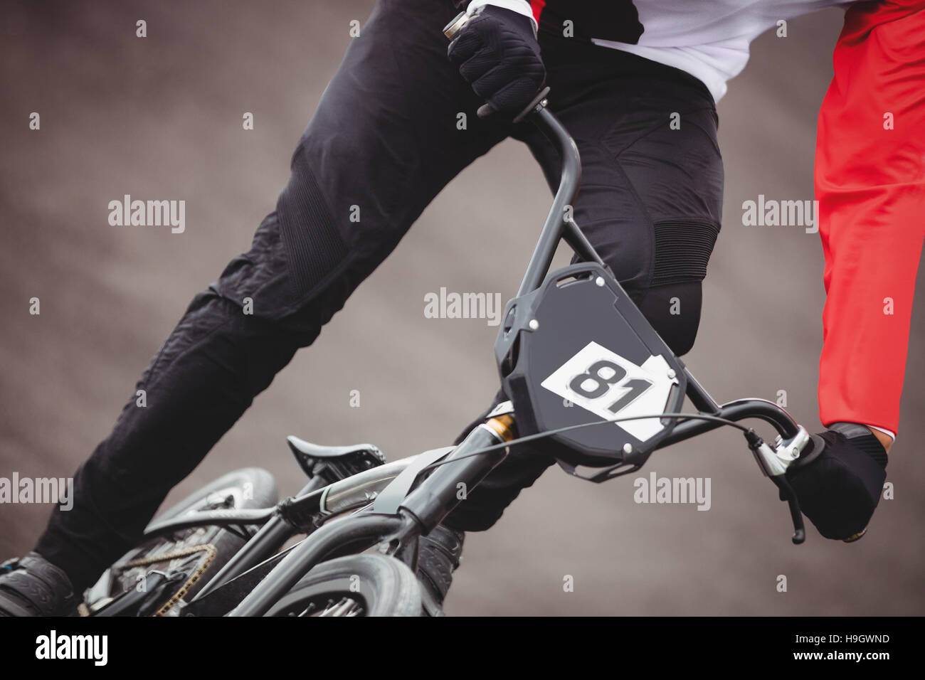 Cyclist riding BMX bike Stock Photo - Alamy
