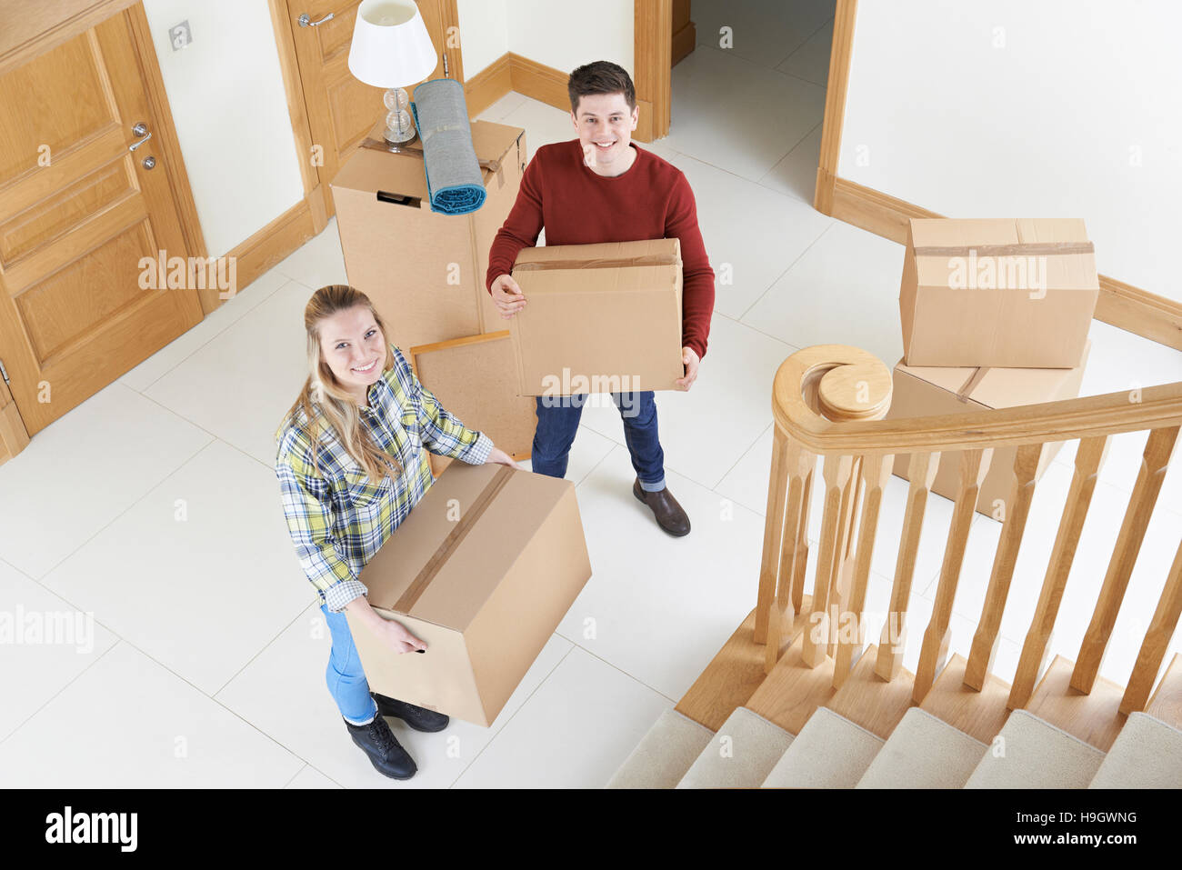 Young Couple Moving In To New Home Stock Photo