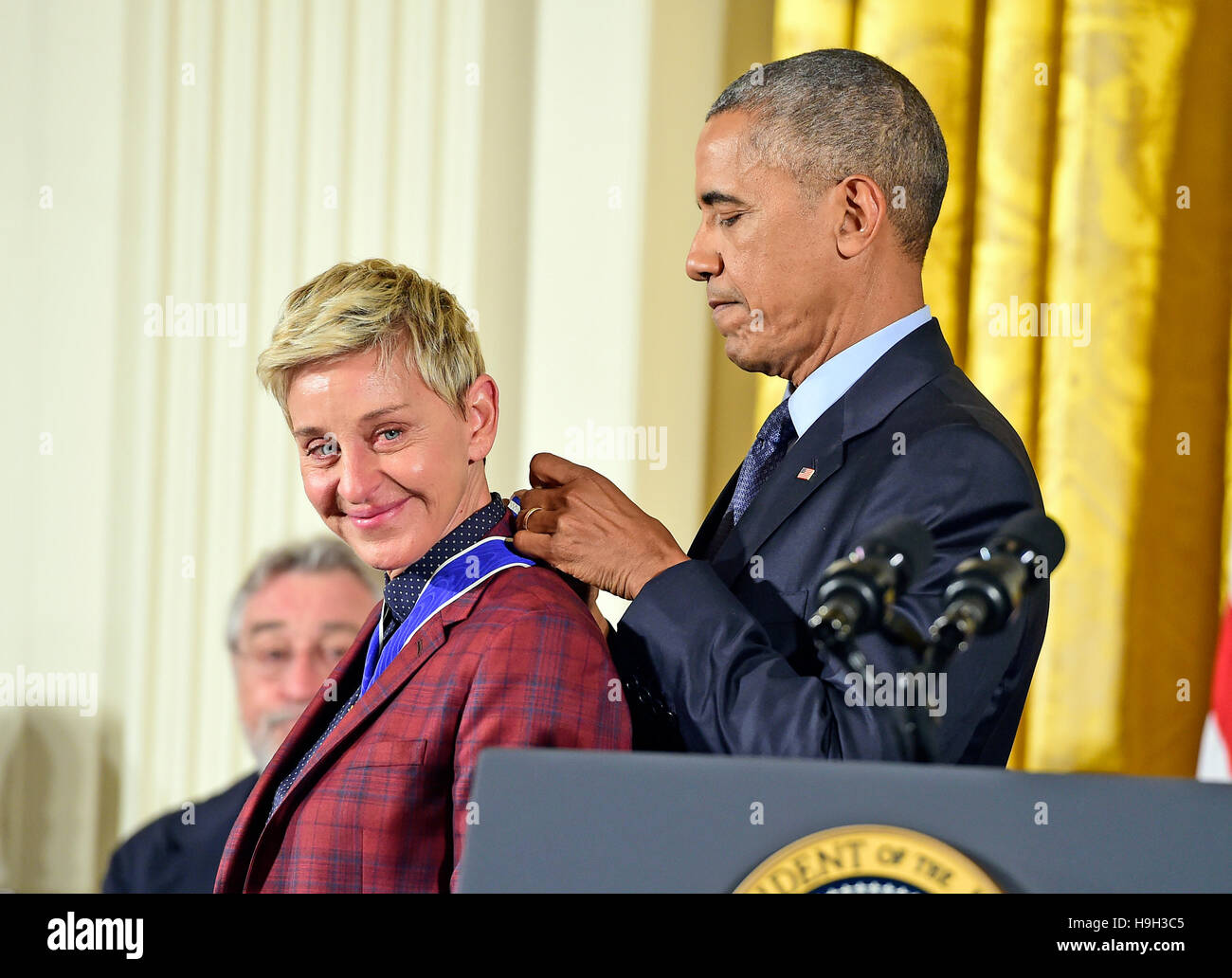 United States President Barack Obama presents the Presidential Medal of  Freedom to comedian Ellen DeGeneres during a ceremony in the East Room of  the White House in Washington, DC on Tuesday, November