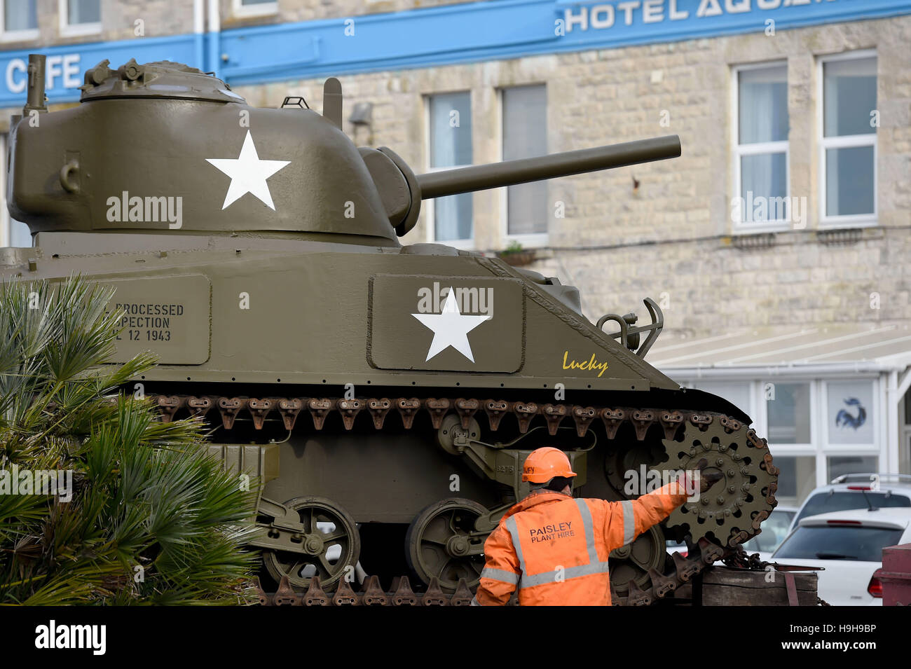 Castletown, Portland, Dorset, UK. 24th November, 2016. World War 2 Sherman tank is lifted into position at the new 'Castletown D-day Centre' at Castletown, Portland, Dorset, UK Credit:  Dorset Media Service/Alamy Live News Stock Photo