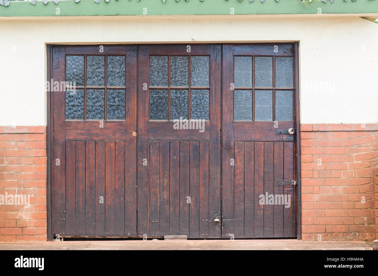 Wood Glass Crafted Vintage Garage Doors On Building Outside