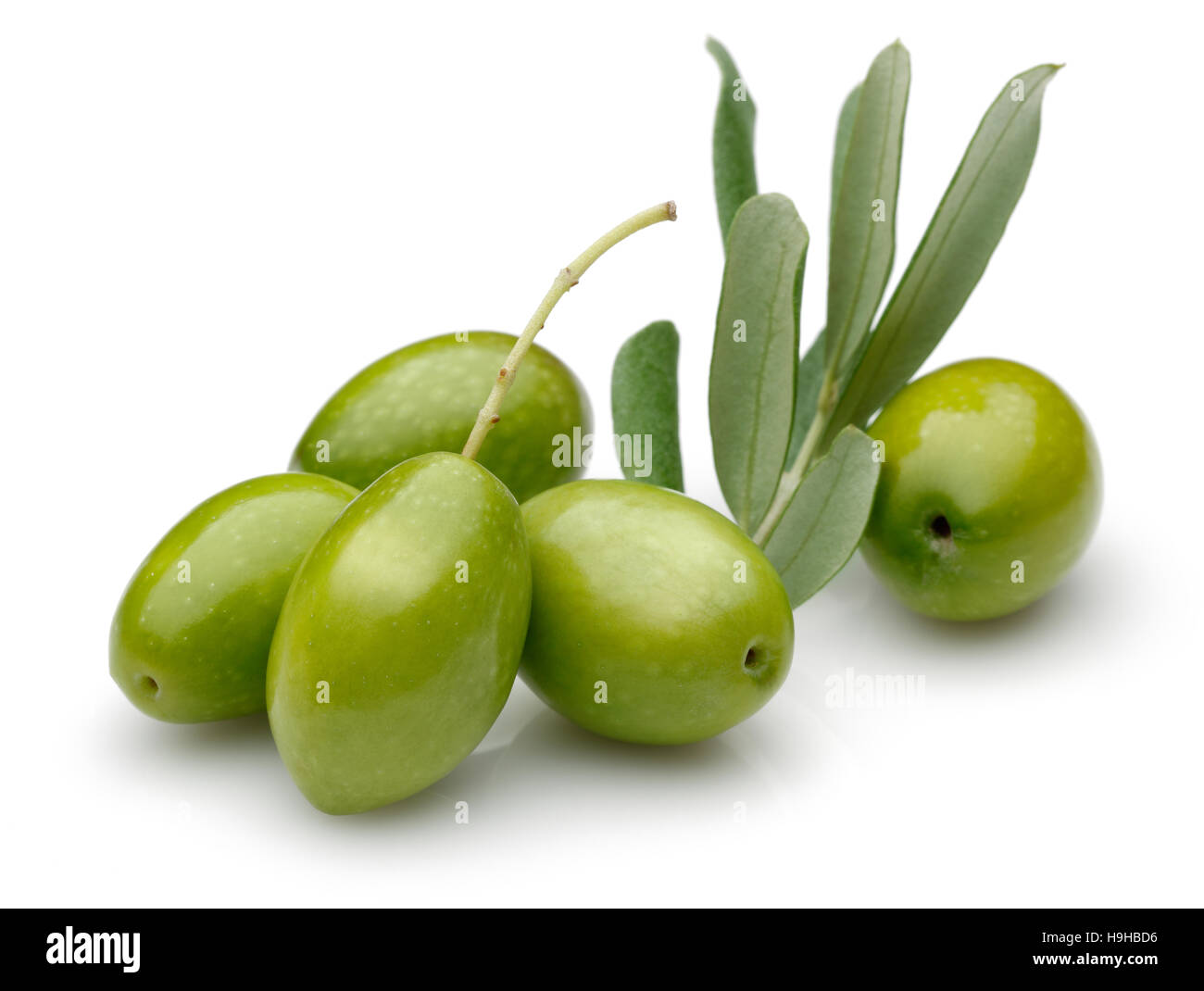 Green Olive with green leaves isolated on white background. Stock Photo