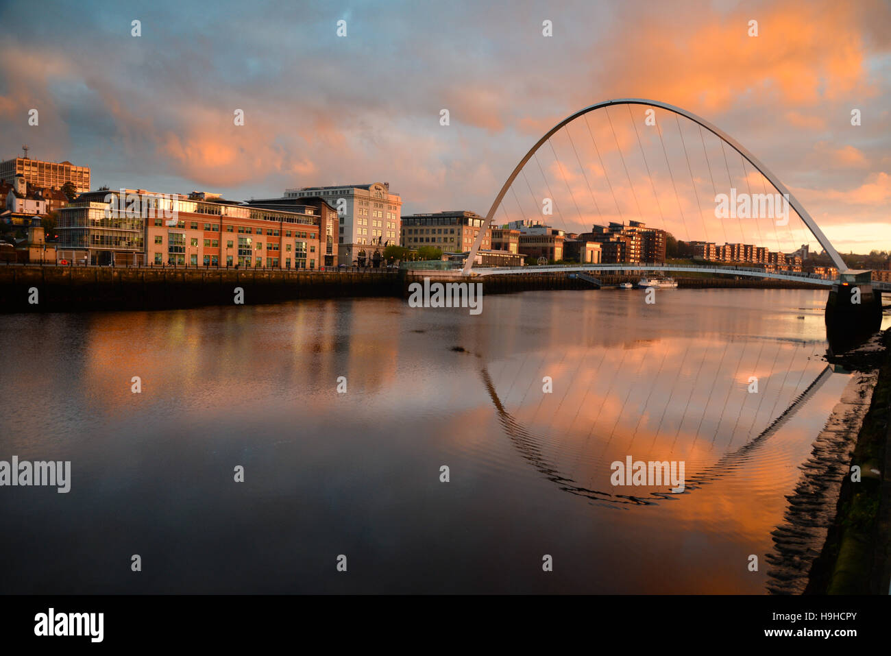 View of the Millennium Bridge connecting the restored waterfronts of Gateshead and Newcastle Stock Photo