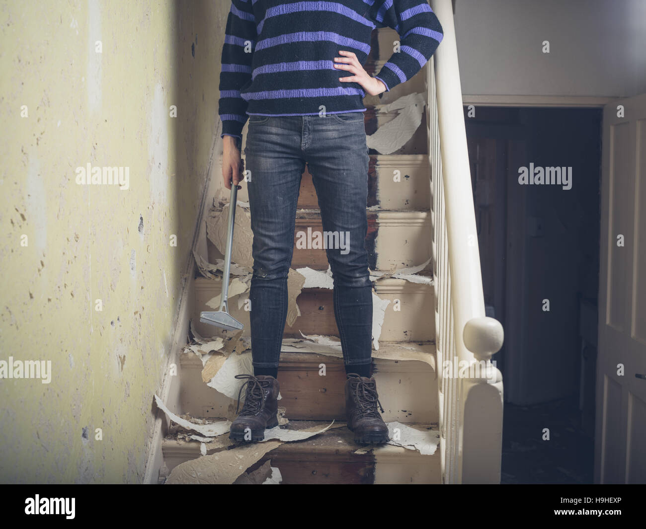 Woman stripping wallpaper hi-res stock photography and images - Alamy