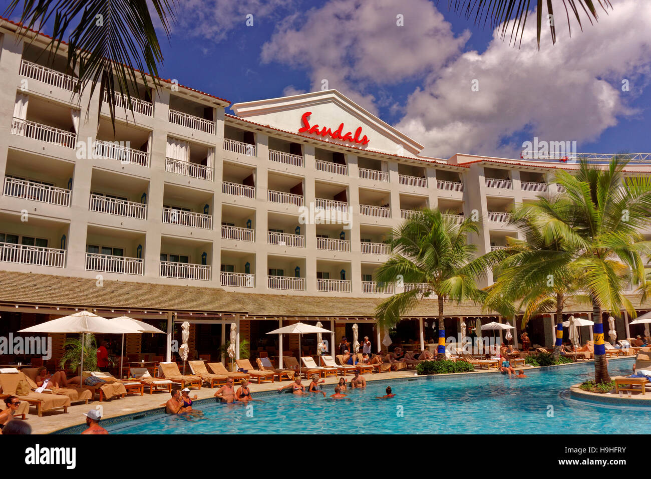 Main building and pool of the Sandals Resort Hotel, St. Lawrence Gap, South Coast, Barbados, Caribbean. Stock Photo