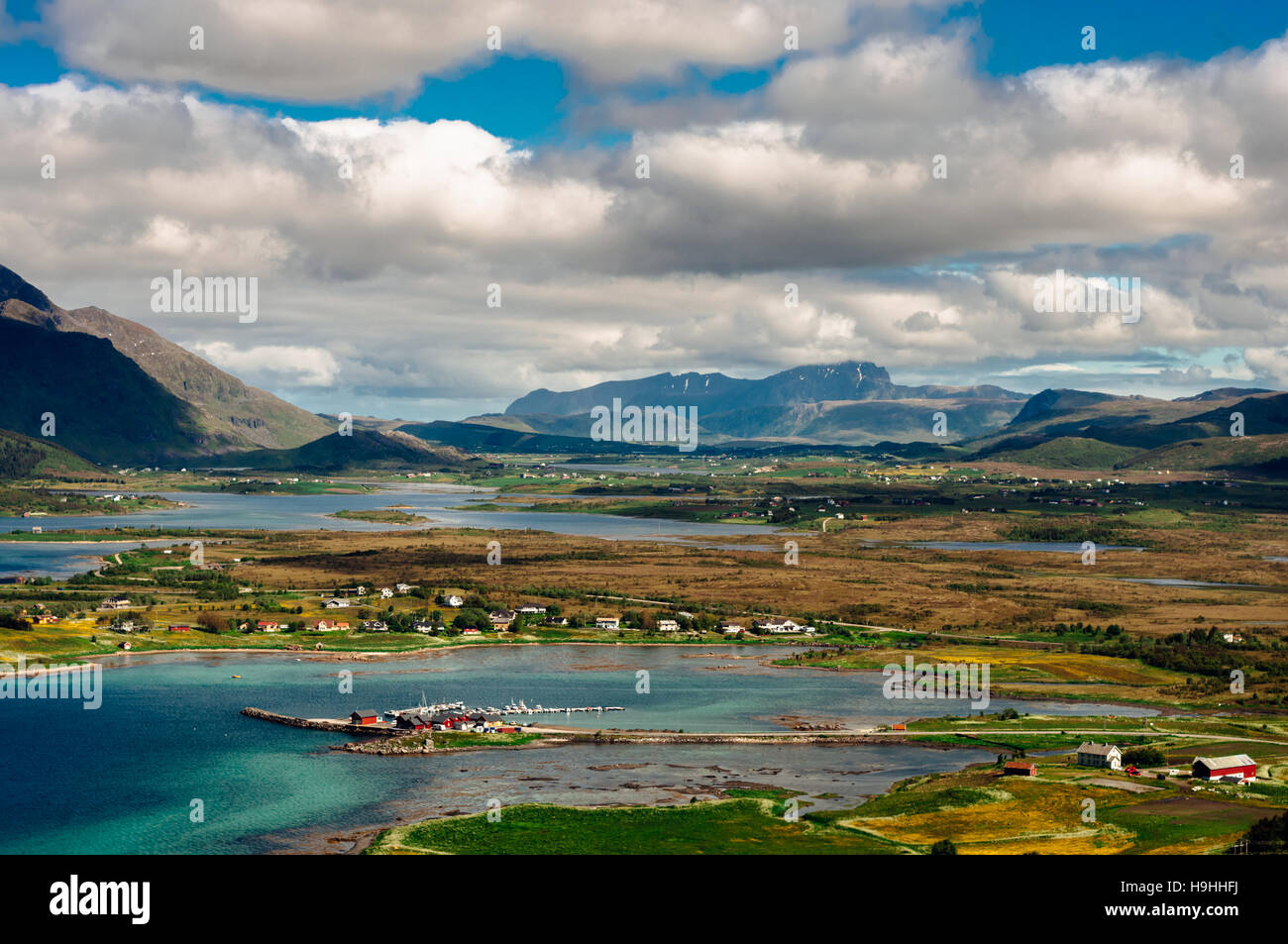 Fjord landscape with little bay near Leknes city and mountains on background, Norway. Beautiful cloudy sky. Stock Photo