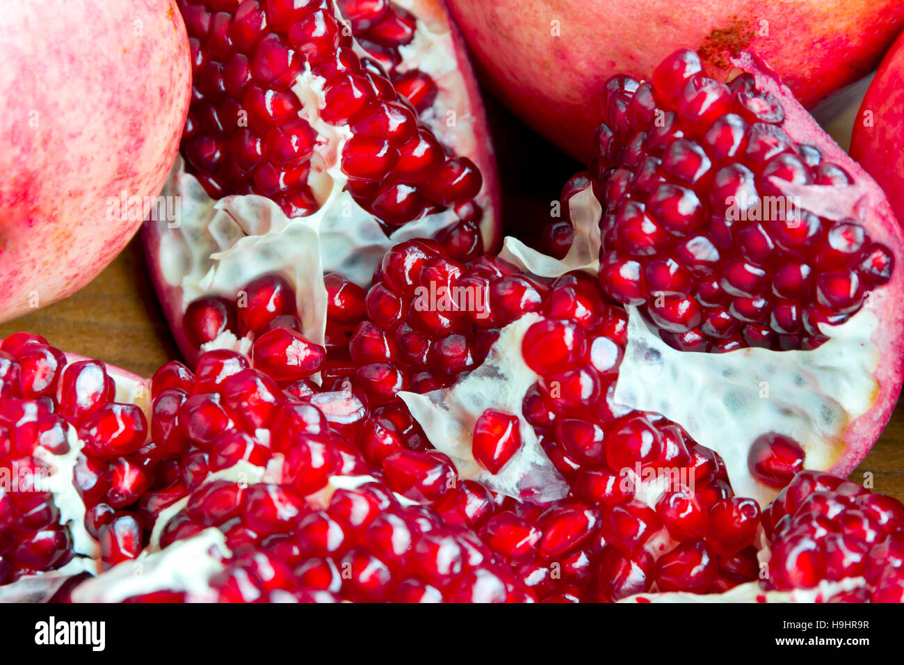 Can opener and pomegranate - open pomegranate for juice Stock Photo - Alamy