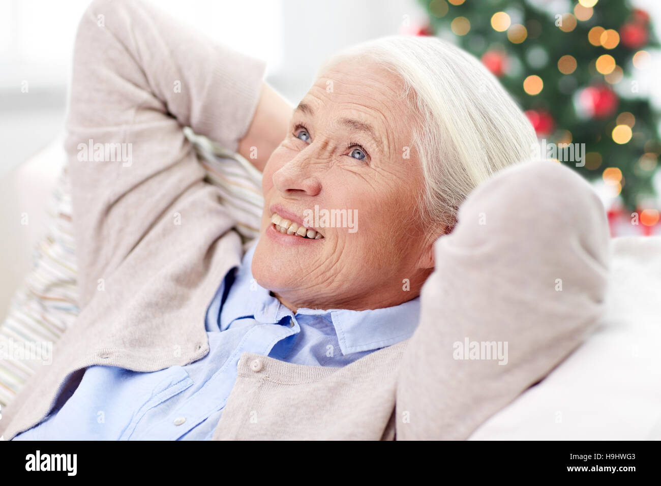 Mature woman christmas happy sofa hi-res stock photography and images ...