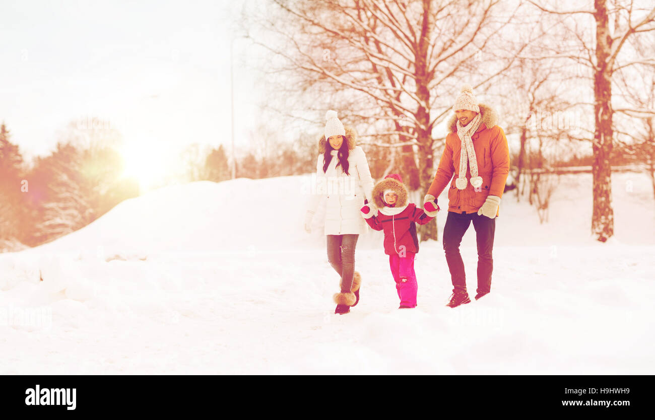 happy family in winter clothes walking outdoors Stock Photo - Alamy