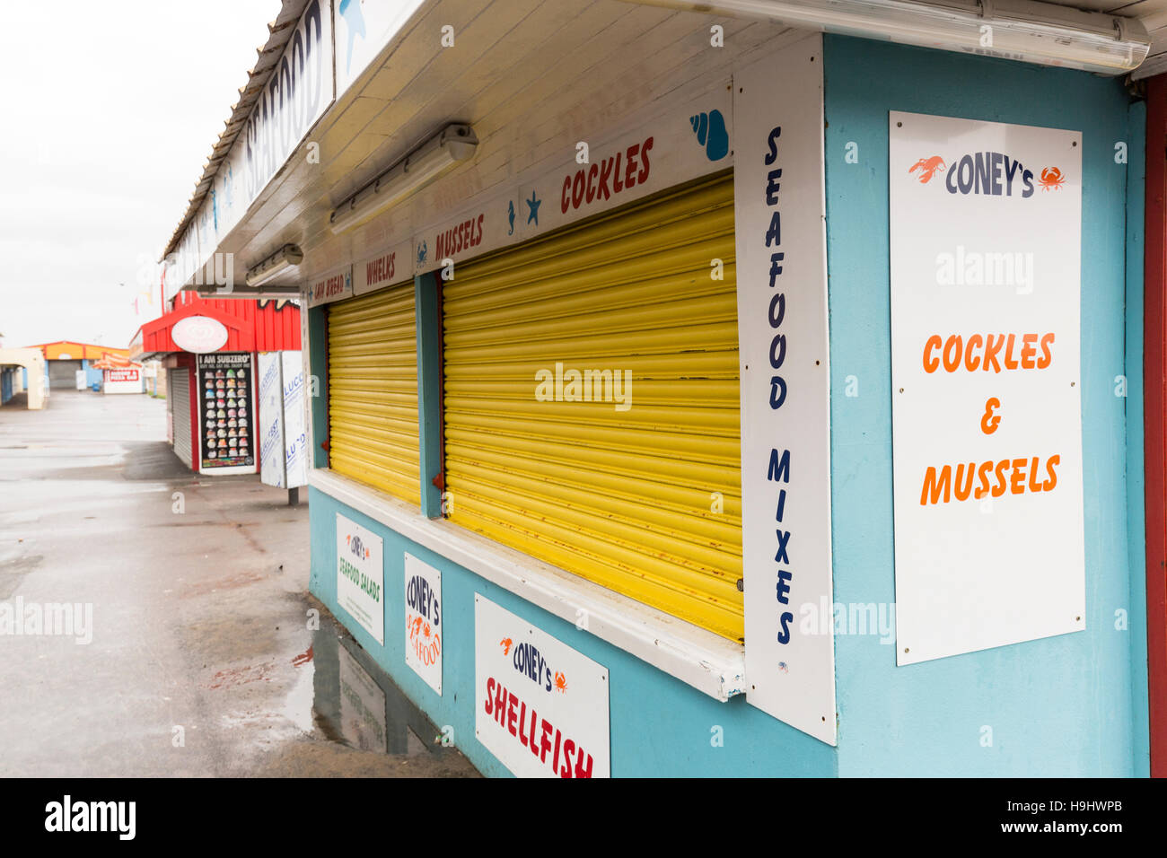 Closed stalls off season at Coney Island funfair, Porthcawl, Wales, UK Stock Photo