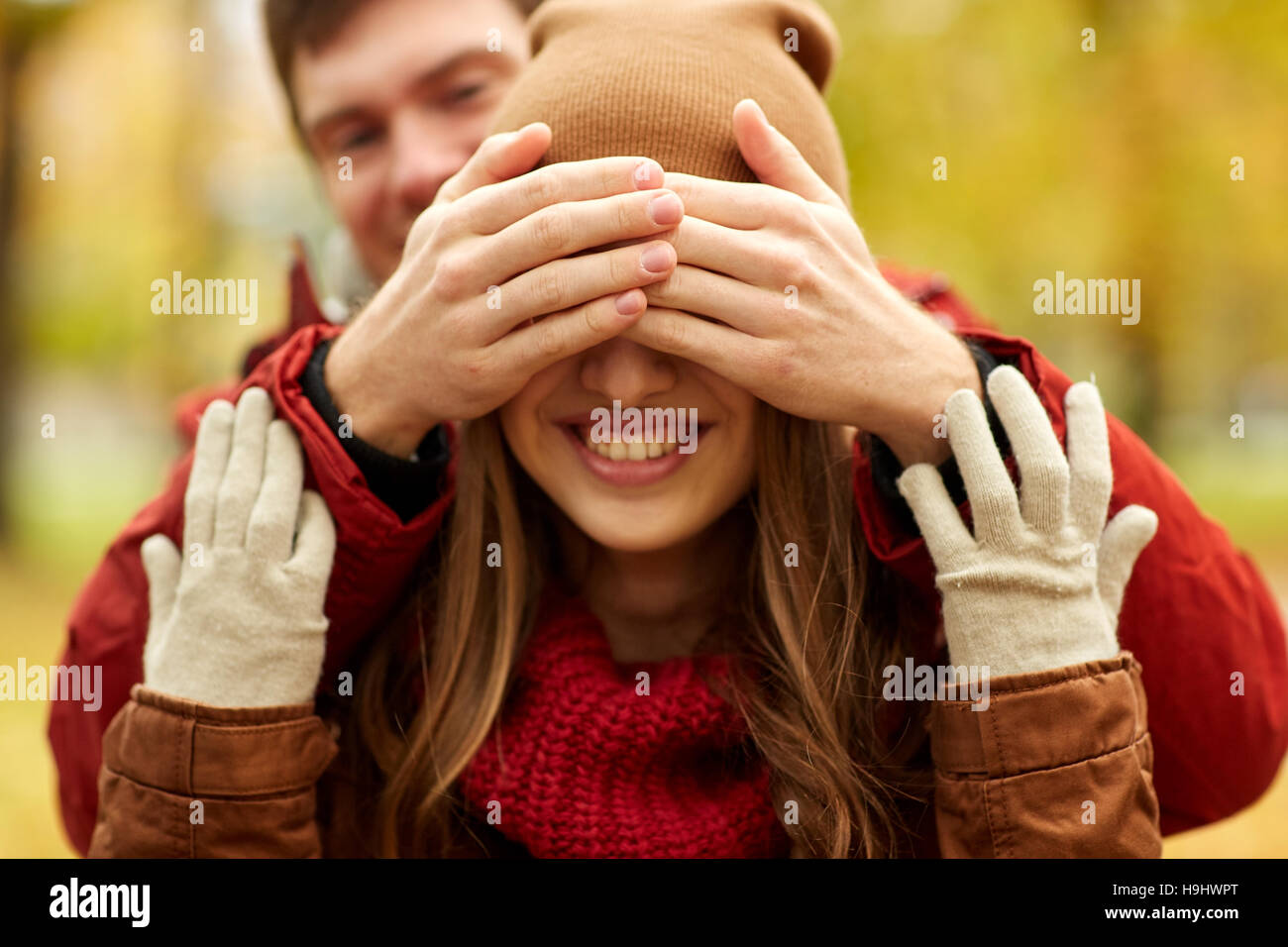 happy young couple having fun in autumn park Stock Photo - Alamy