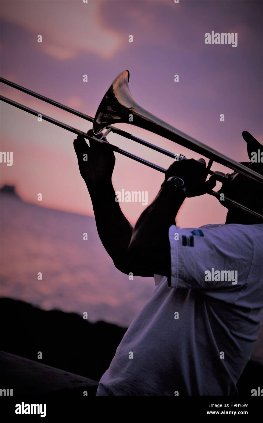 Man playing the trombone at sundown in Havana, Cuba Stock Photo Alamy