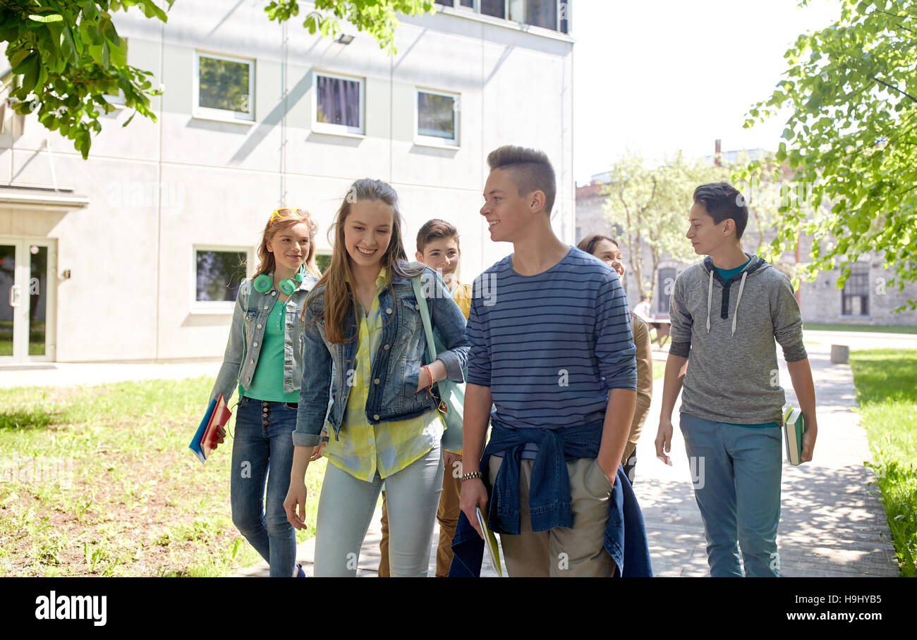 group of happy teenage students walking outdoors Stock Photo - Alamy
