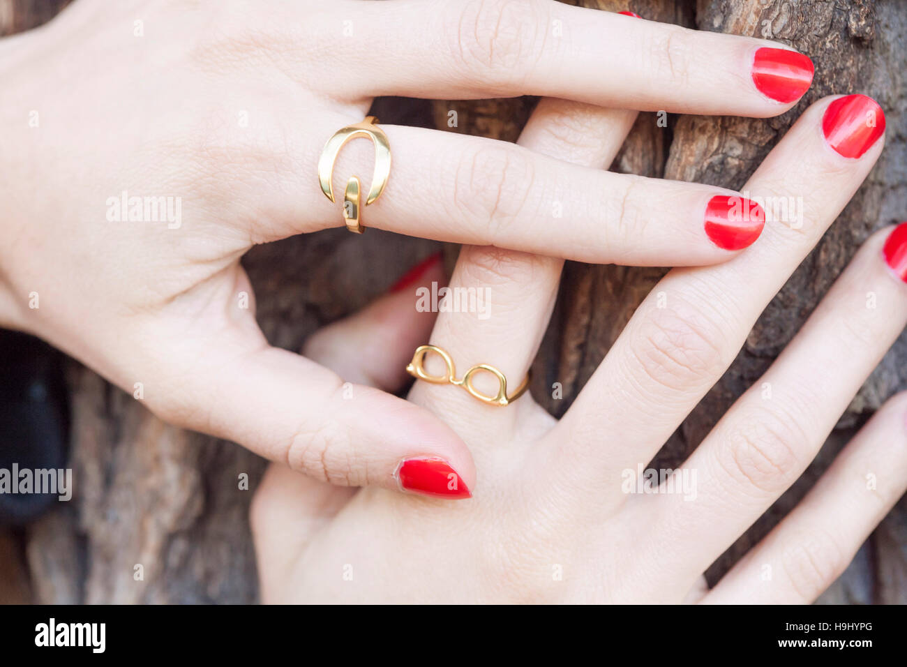 Female hands with collection of hipster golden rings Stock Photo - Alamy