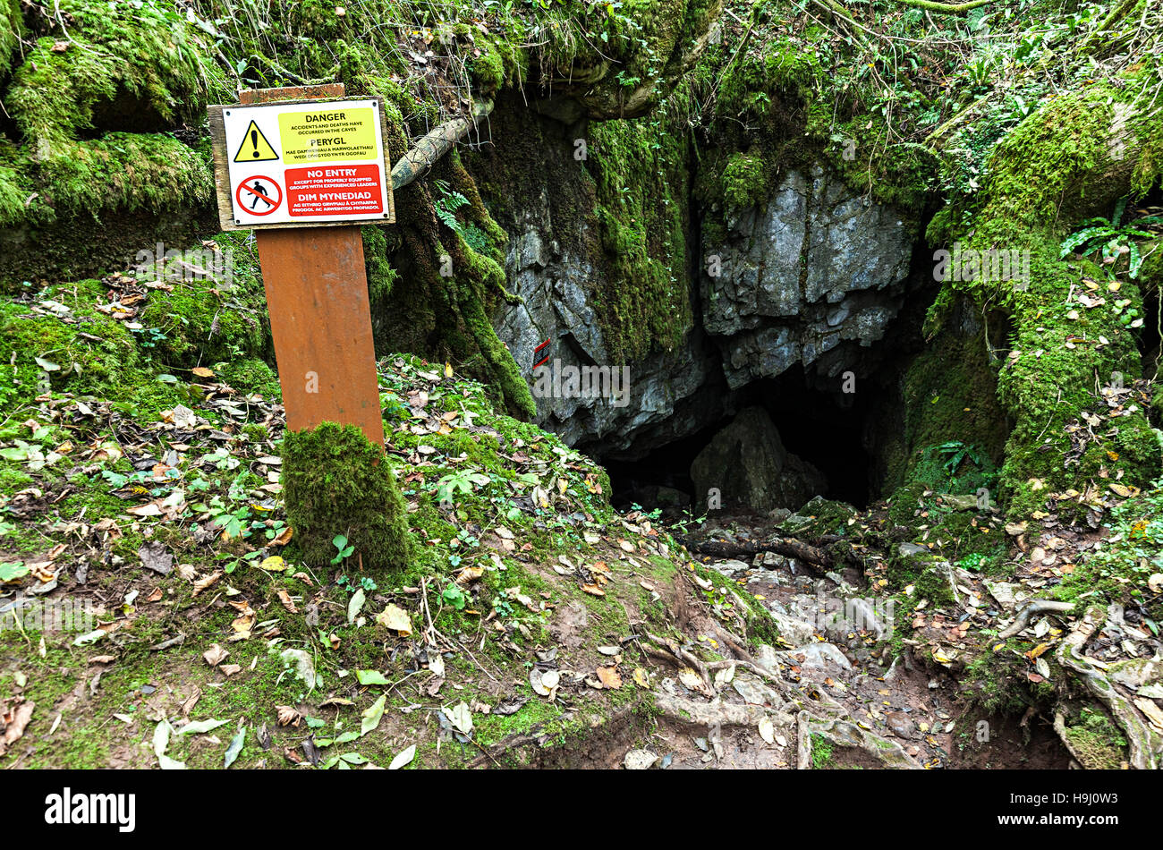Warning sign at entrance to Porth yr Ogof, a cave in the Brecon Beacons national park, Wales, UK Stock Photo