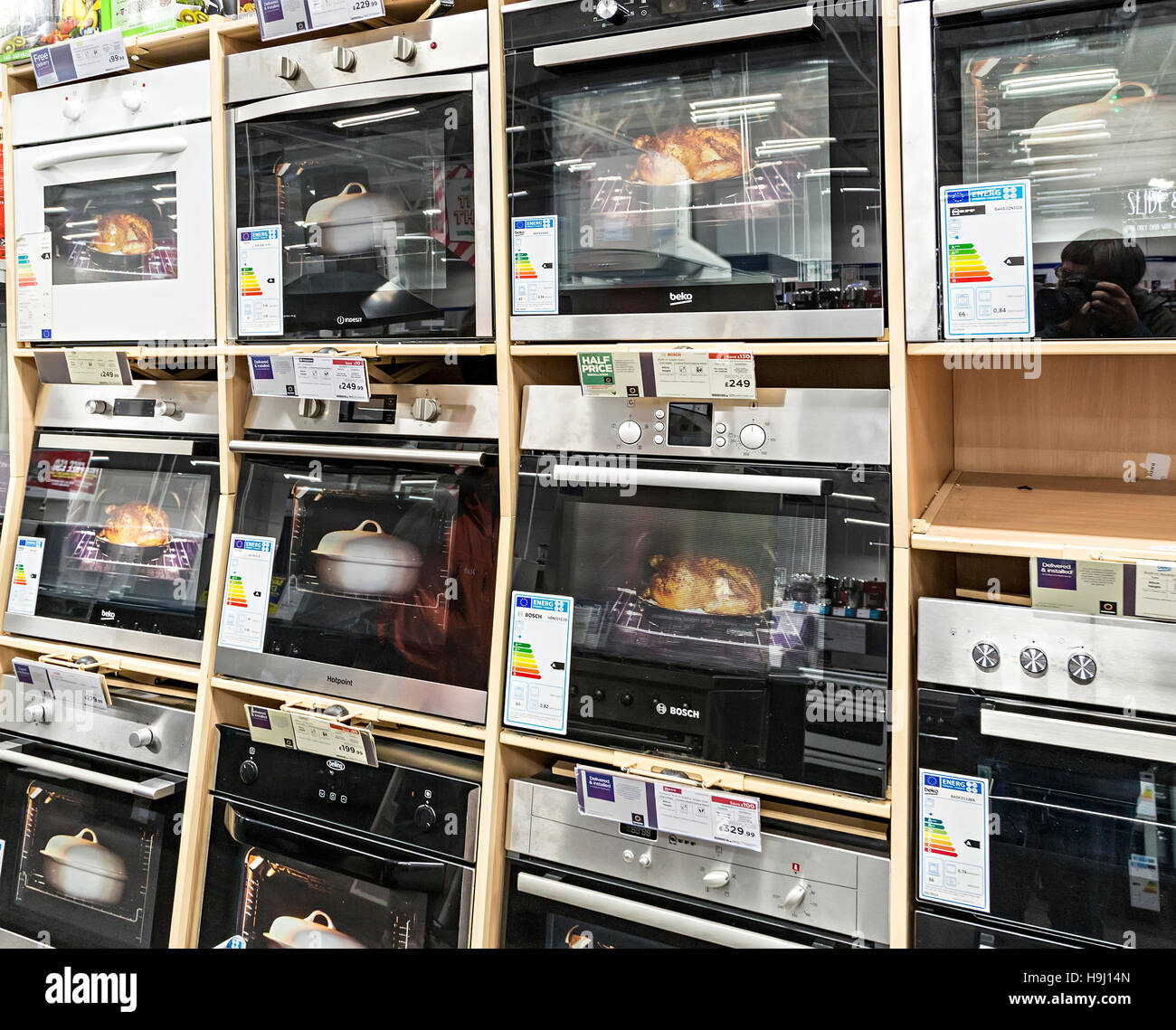 Electric ovens on sale with energy rating labels, UK Stock Photo