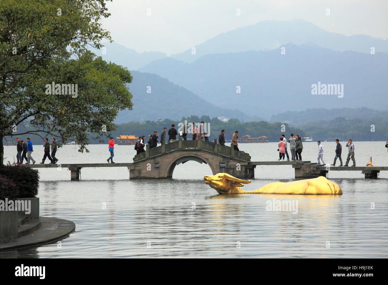 China, Zhejiang, Hangzhou, West Lake, Golden Buffalo statue, people, Stock Photo