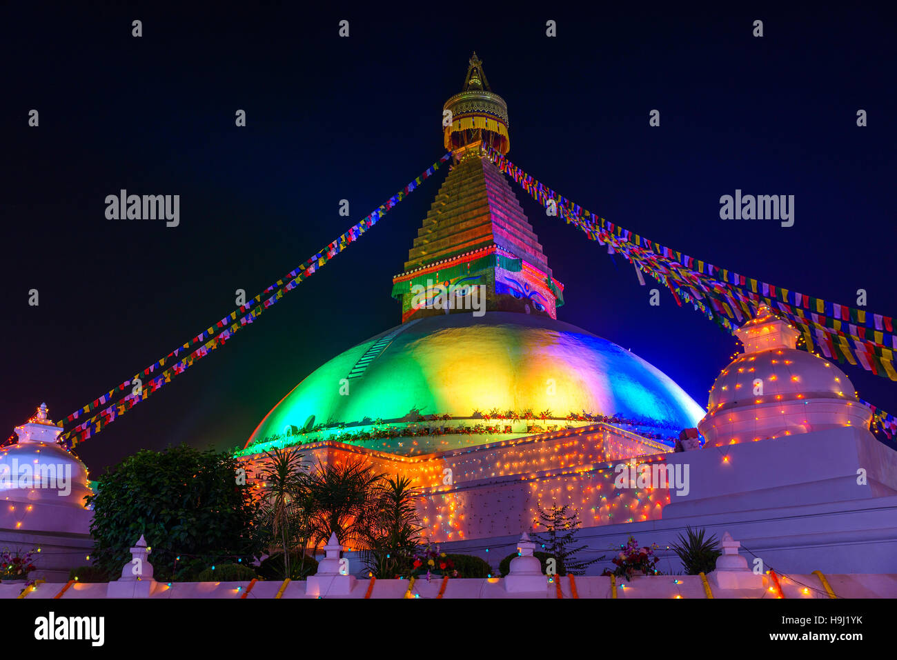 Renovated Boudhanath stupa lit for its inauguration in Kathmandu, Nepal Stock Photo