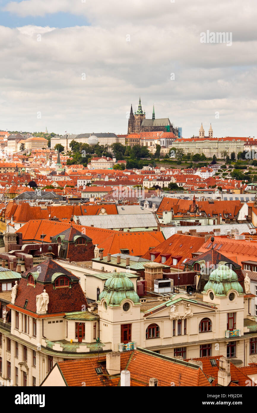 High up view of Prague rooftops  with St. Vitus cathedral in the distance Stock Photo