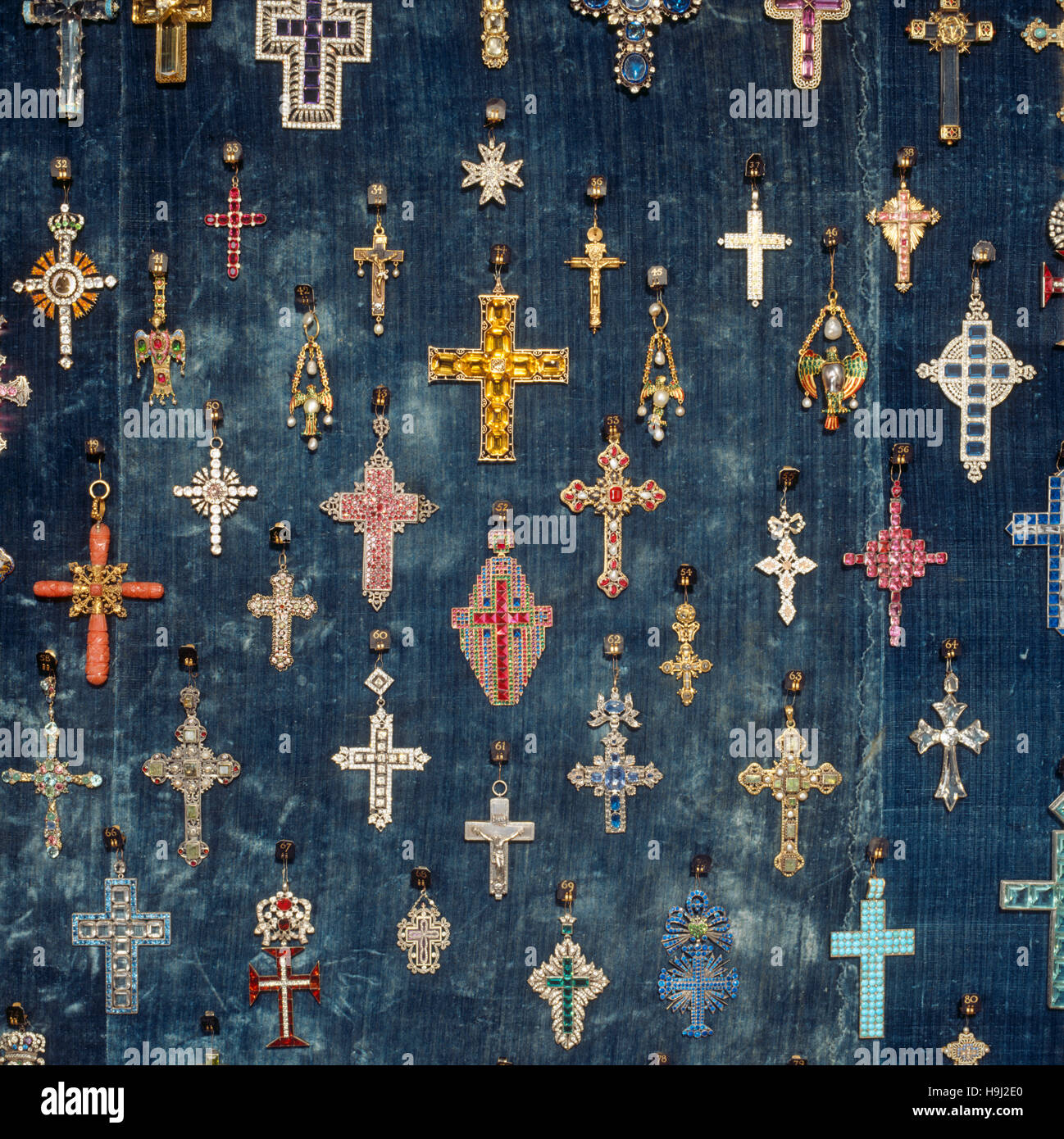The Tapestry Hall, close-up view of display case containing a collection of mainly 19th century crosses of gold, silver and gilt metal, set with paste Stock Photo