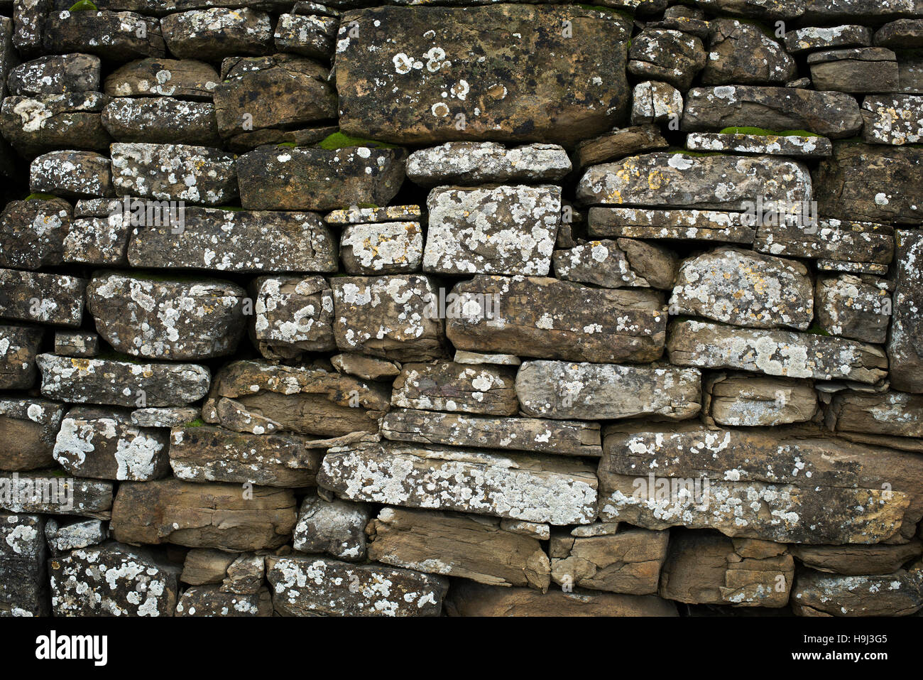 old gray stone wall texture background close up Stock Photo - Alamy