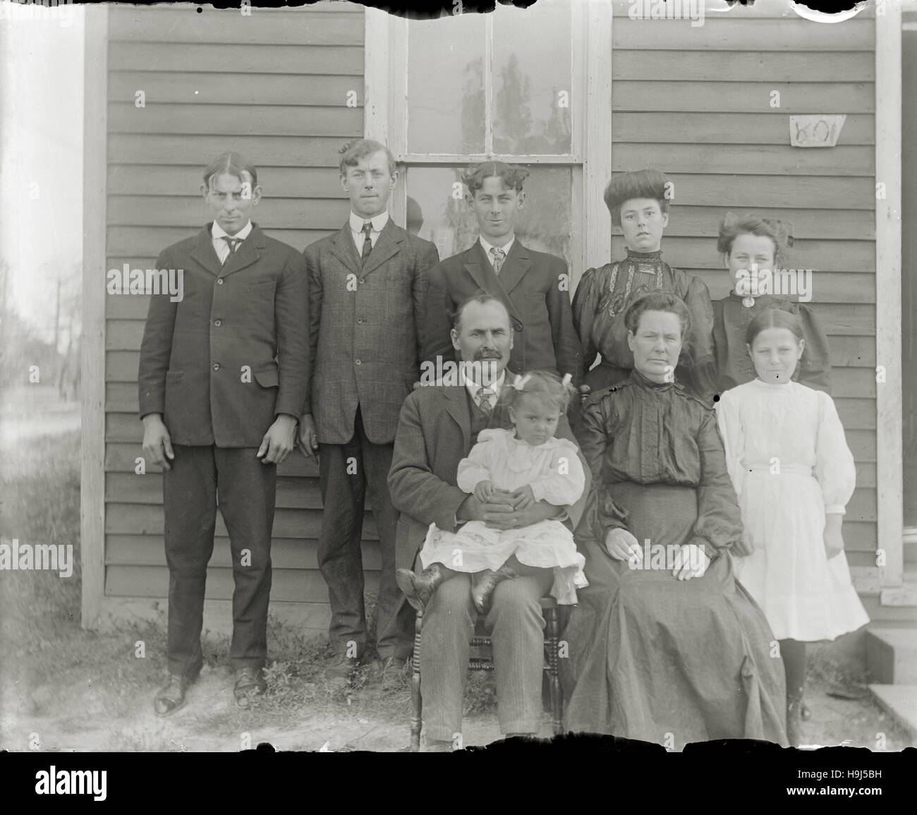 Antique c1890 photograph, three generation family portrait. Location unknown, probably midwest (Indiana or Ohio) USA. SOURCE: ORIGINAL PHOTOGRAPHIC NEGATIVE. Stock Photo